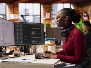 it-expert-interacting-with-ai-llm-chatbot-pc-software-development-startup (1)